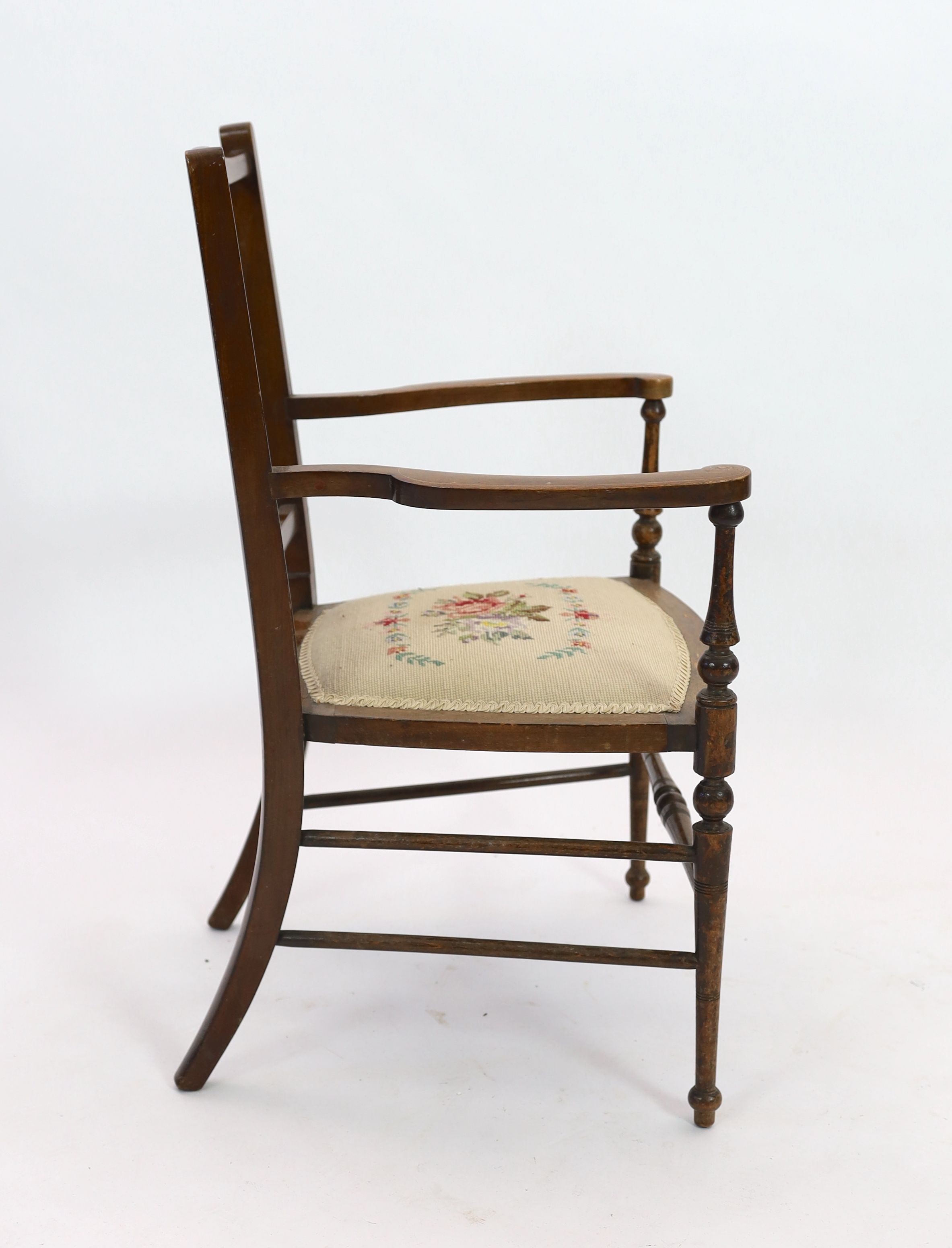 An Edwardian inlaid mahgany elbow chair